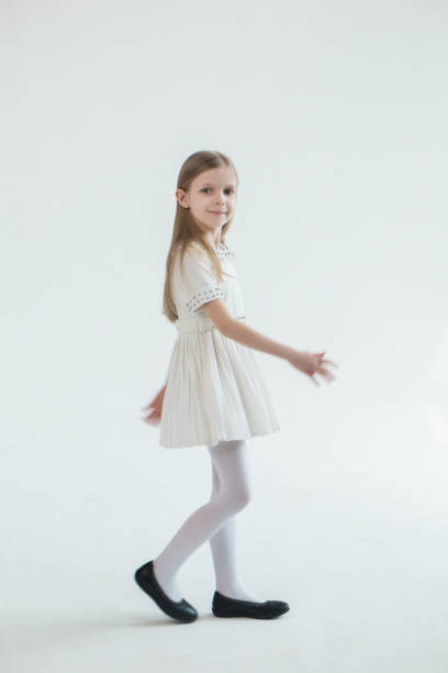Girl in white studio stock photo
