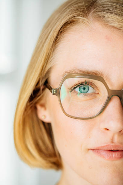 Woman wearing eyeglasses close-up stock photo