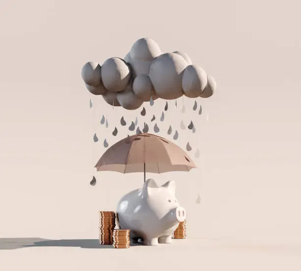 Photo of Piggy bank with stacked coins and umbrella under the rainy cloud