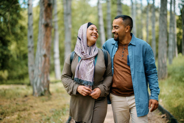 istock Happy Muslim couple talking while enjoying in a walk in nature. 1399233167
