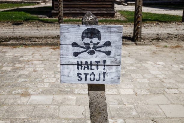 Stop sign at the Auschwitz-Birkenau concentration camp. Holocaust memorial.