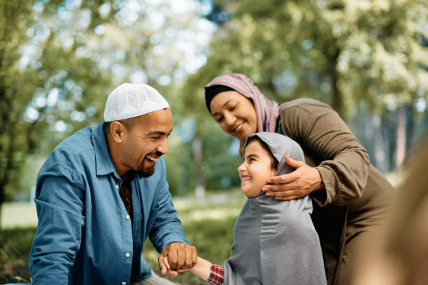 istock Happy Muslim parents and their daughter having fun while spending a day in nature. 1399233519