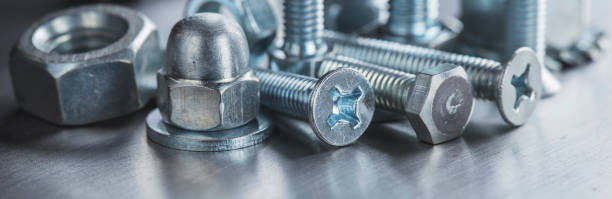 istock set of different nuts, bolts, screws, washers and drill bits,thread tap and mill cutters on steel plate background. Locksmithing deal. 1399236772
