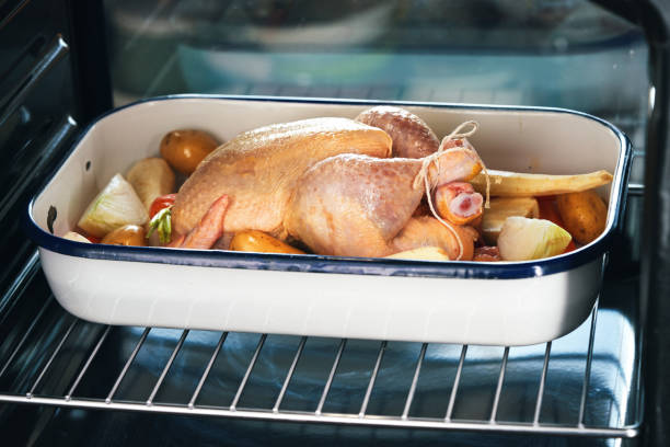 Preparing Roasted Chicken with Root Vegetables in Domestic Kitchen