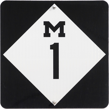 Highway sign designating Michigan Highway 1, M1. In Detroit this is also iconic Woodward Avenue, site of the Dream Cruise.