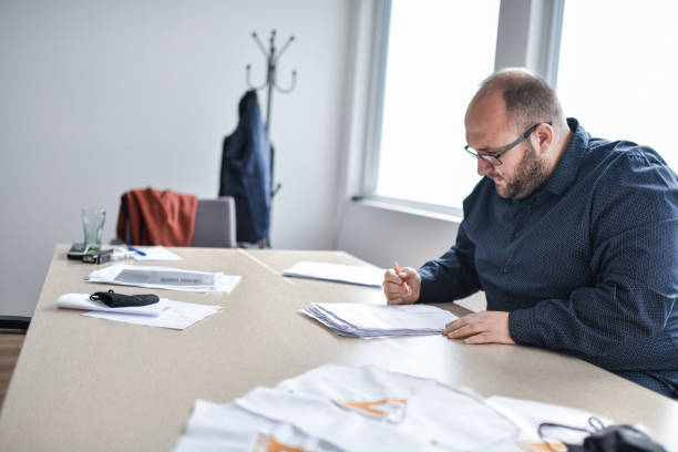 istock Company Manager Writing New Agreement In Office 1399238827
