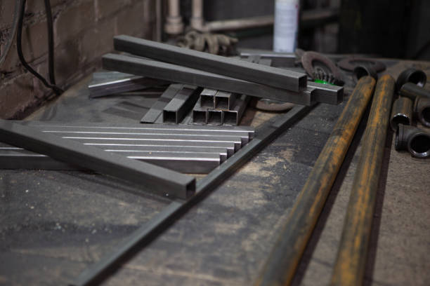 istock Metal pipes and bars are randomly lying on the old desktop 1399239977