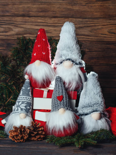 istock Christmas composition with gnome and festive decorations on wooden background. 1399240227