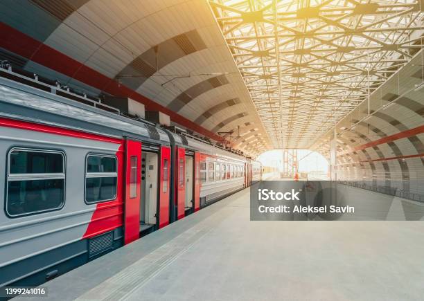 An Electric Train At A Modern Station In The Sunlight Stock Photo - Download Image Now