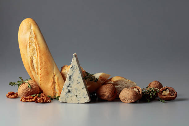 Blue cheese with baguette, walnuts, and thyme. Traditional Mediterranean snacks.