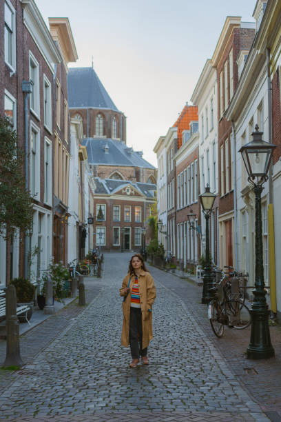istock Woman walking in Leiden town at sunset 1399247420