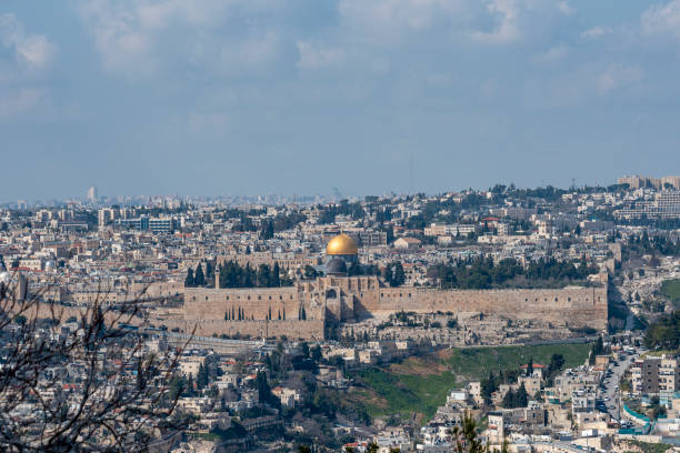 istock Jerusalem old city, holy mountain. Jerusalem of Gold under cloudy sky - old town view from Mount of Olives 1399248564