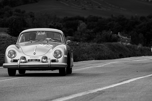 CAGLI , ITALY - OTT 24 - 2020 : PORSCHE 356 1600 COUPÉ 1956 on an old racing car in rally Mille Miglia 2020 the famous italian historical race (1927-1957)