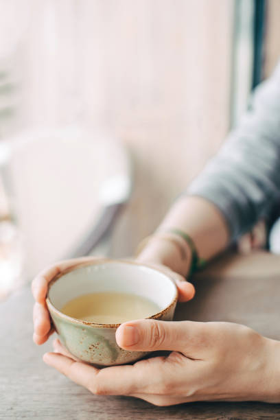 istock Women's hands hold a cup of tea. 1399251168