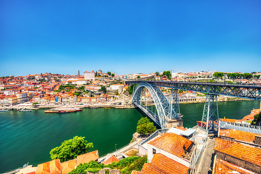 Porto Aerial Cityscape with Luis I Bridge and Douro River during a Sunny Day, Portugal