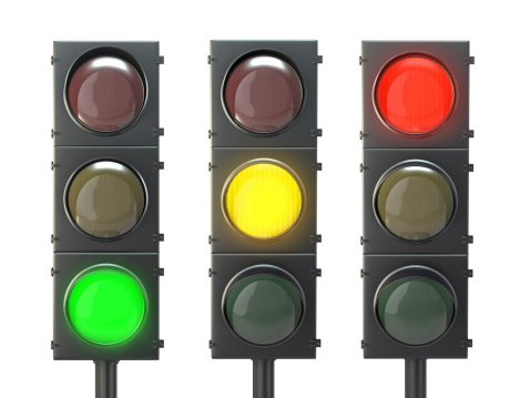 Set of traffic lights with red, yellow and green lights isolated on white background