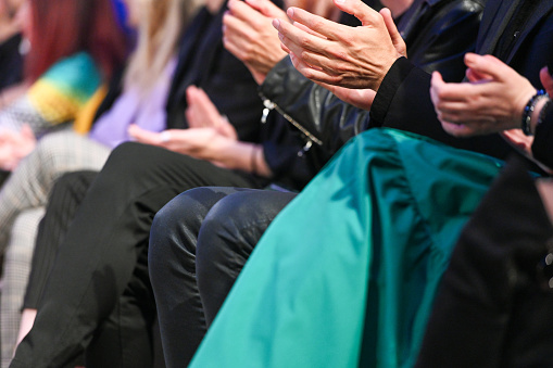 The attendees applauding during conference