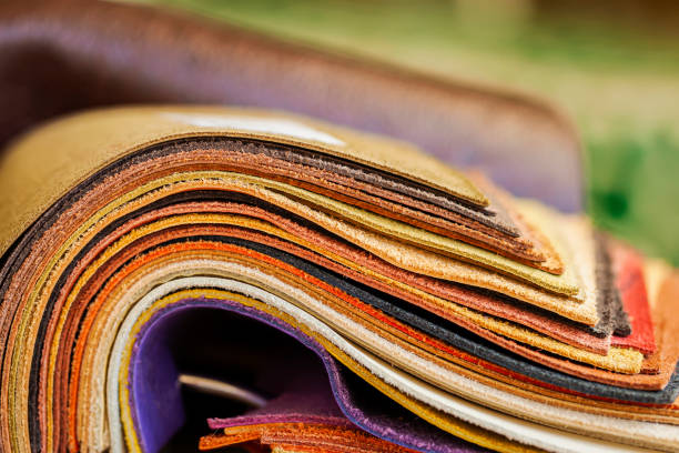 rolled up colorful leather samples, fashion industry concept - patch textile stack heap imagens e fotografias de stock