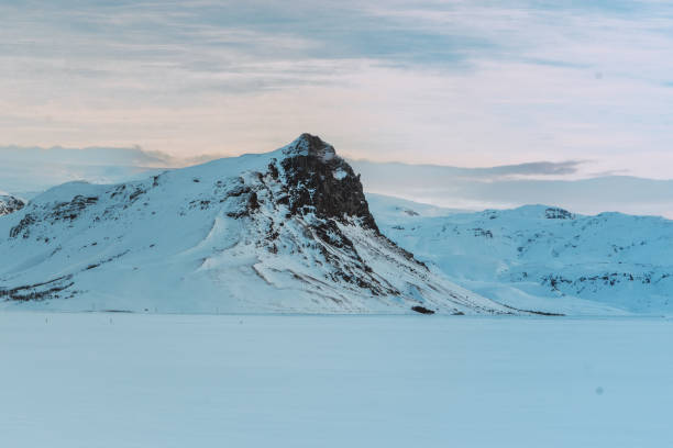 istock Large snow-covered mountain behind an esplanade 1399264413