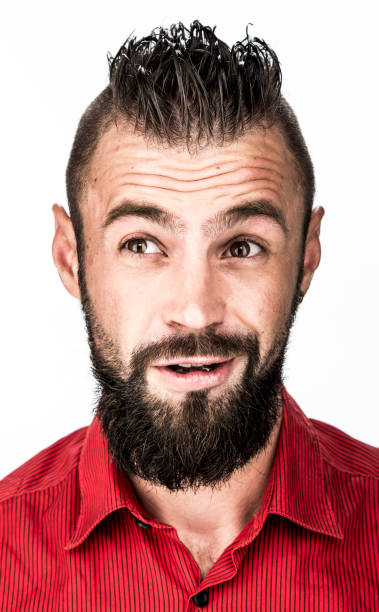 istock funny guy with a beard in a red shirt close-up shows different emotions. cheerful kind sad surprised satisfied range of emotions 1399269116
