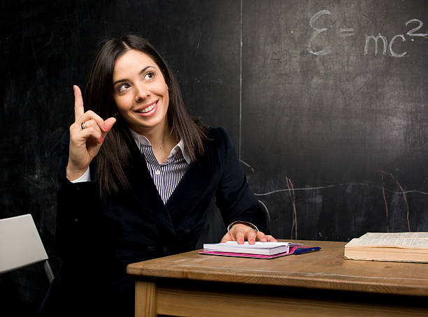 istock portrait of happy cute student at blackboard 139927109