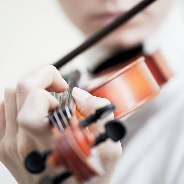 istock Girl playing violin 139927124