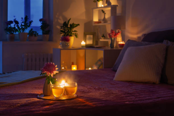 istock cozy bedroom in  evening with flowers and tea 1399276742