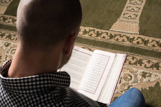 istock Muslim Man Is Reading The Koran 1399277912