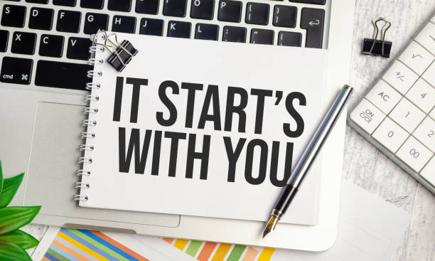 notebook with the inscription - IT STARTS WITH YOU