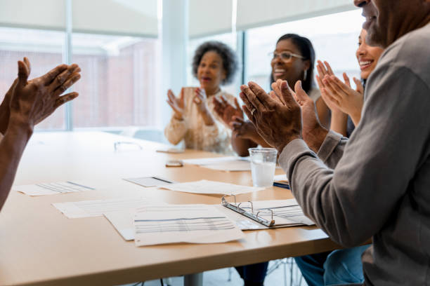 istock Team applauds their new accomplishments 1399284573