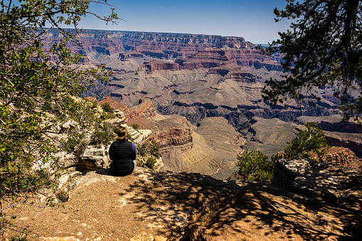 Sitting on the ledge at Shoshone Point in Grand Canyon National Park, Arizona.