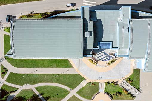 roof of modern business office building  in sunny day. top view aerial photo from flying drone.