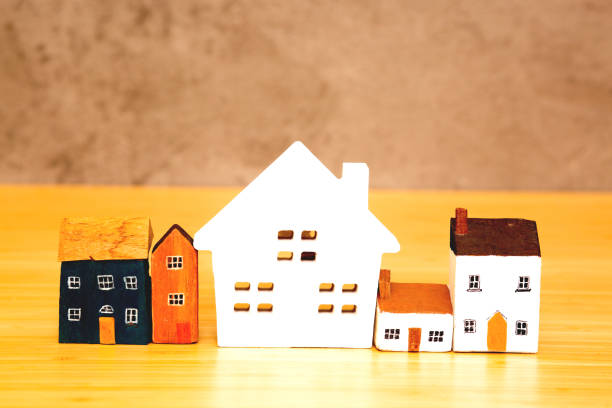 istock model house on plywood background 1399298519