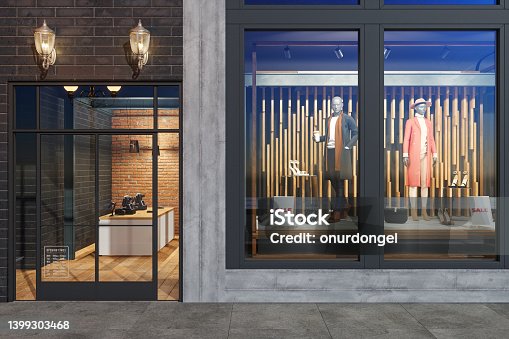 istock Facade Of Clothing Store With Mannequins, Clothes And Shoes Displaying In Showcase 1399303468