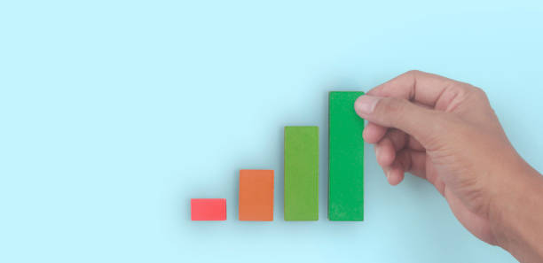 istock Business connecting piece of multi colored pie chart in  hand 1399304049