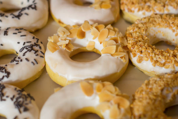 istock assorted donuts with chocolate frosted, pink glazed and sprinkles donuts 1399304309