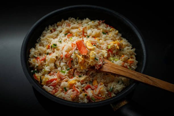istock Fried rice with crab sticks in a pan for home cooking 1399307229