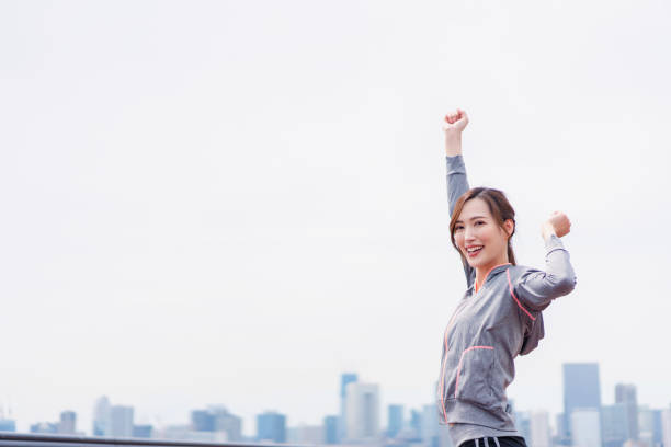 istock Young woman taking a deep breath in sportswear 1399308362