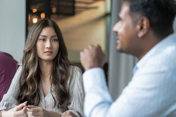 istock Chinese Lady discussing with her coworker 1399309865