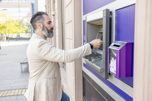Man withdrawing cash from ATM