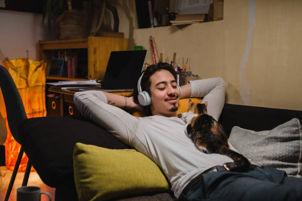 istock young man relaxing at home 1399314823