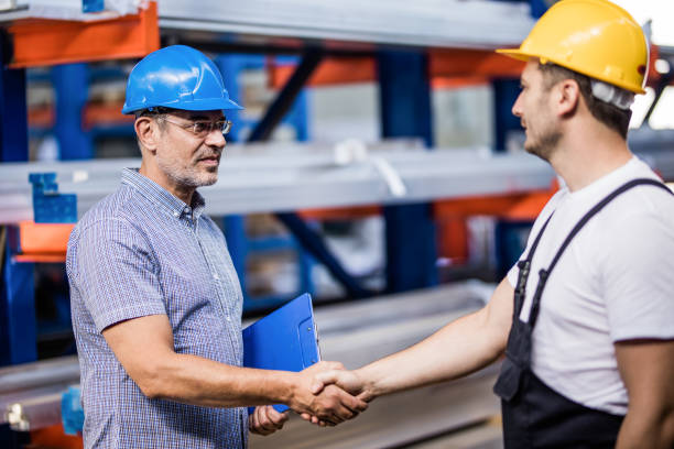 istock Metal worker greeting manager in aluminum mill. 1399315645
