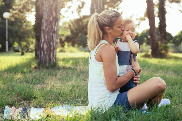 istock mother and her son exercises outdoor 1399315646