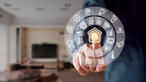 istock Man hand point smarth home GUI in livingroom. Hand use smart screen smart home automation assistant on a virtual screen and a user touching a button 1399320062