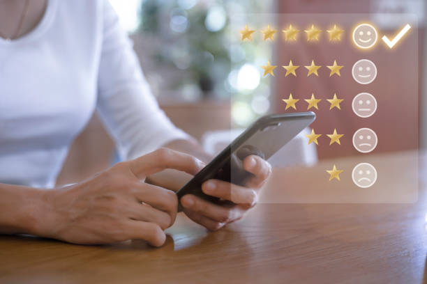 istock Customer service and Satisfaction concept ,Women hand hold smart phone empty screen choose the 5 star icon to give satisfaction in service. rating very impressed in coffeeshop. 1399320112