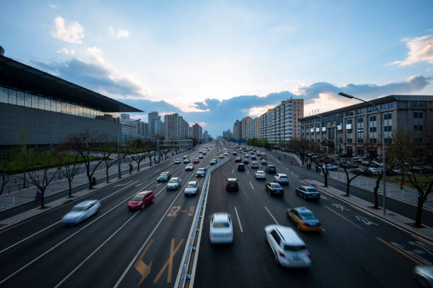 Long exposure of traffic in curve with red and white trails of light