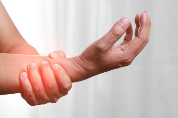 Wearing wrist support to reduce movement can increase injury. Cold compresses to reduce inflammation. stock photo