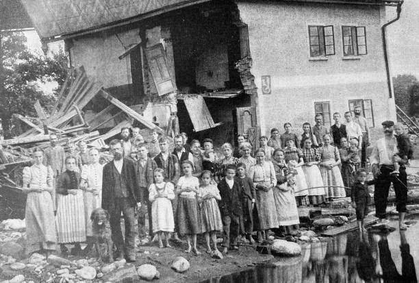 istock People standing in front of the damaged house 1399323579