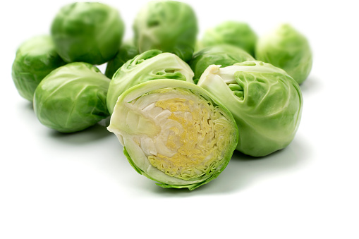 Brussels sprouts wedges isolated. Brassica oleracea cabbage cuts, sliced edible buds on white background close up
