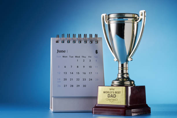 istock world best dad trophy against blue background 1399326874